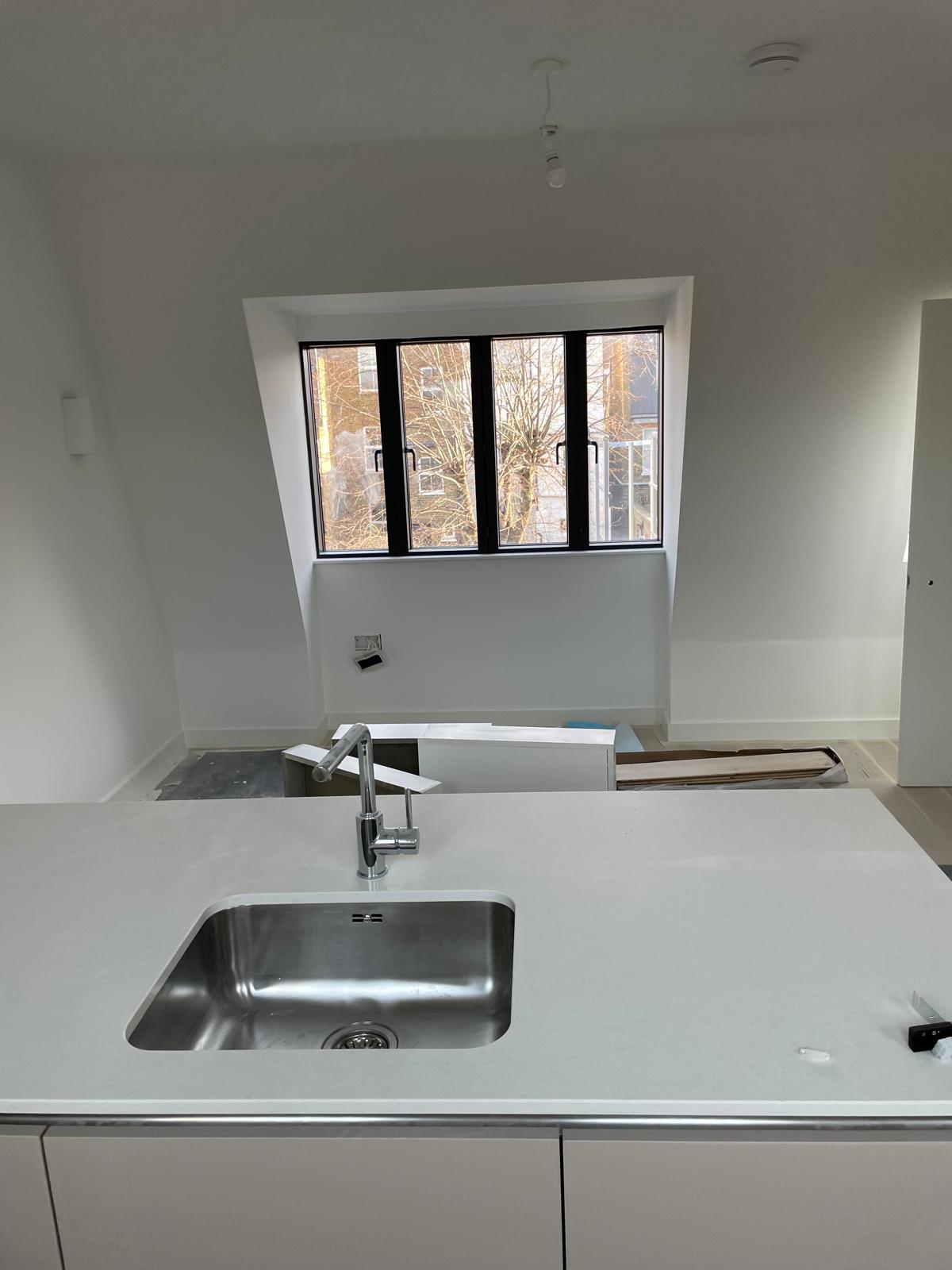 Worktops and sinks fitted to the kitchen islands.