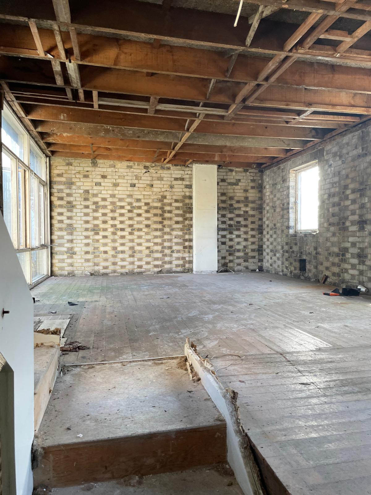 Main living space stripped back to the original brickwork.