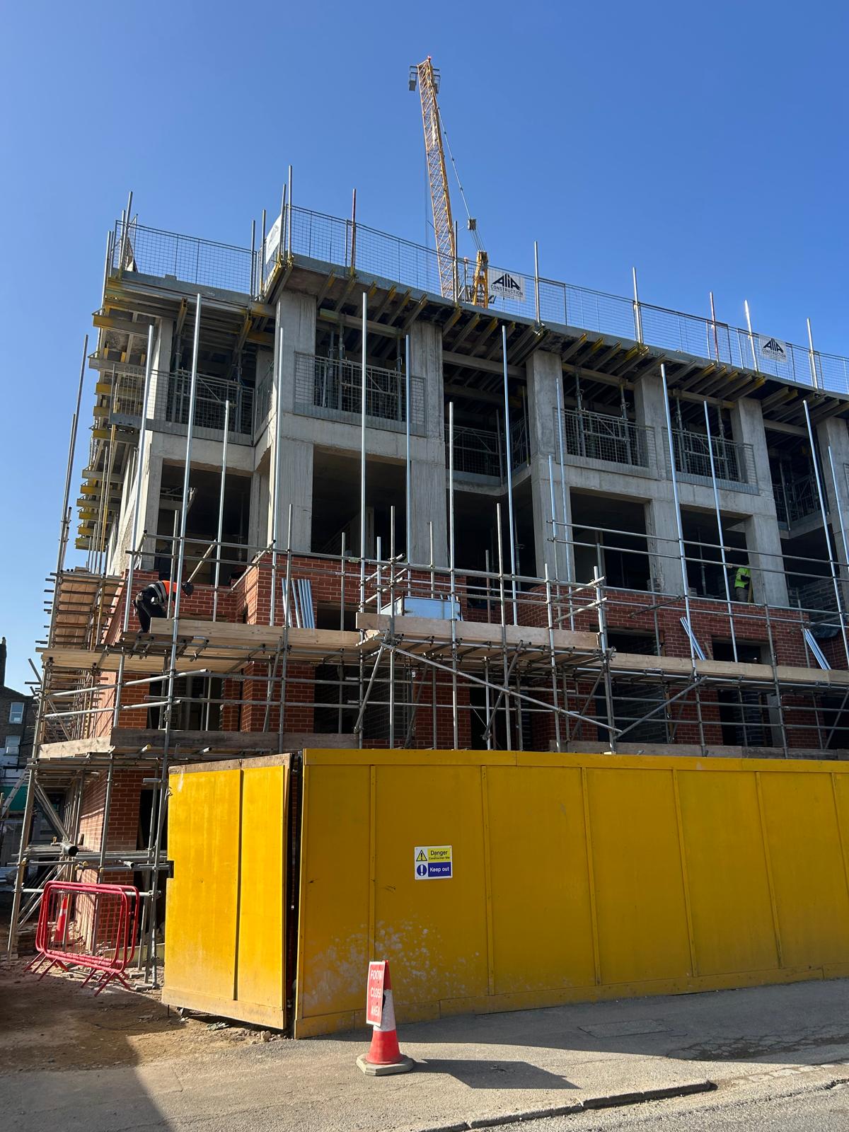 Scaffolding around the frame as the elevations move up.