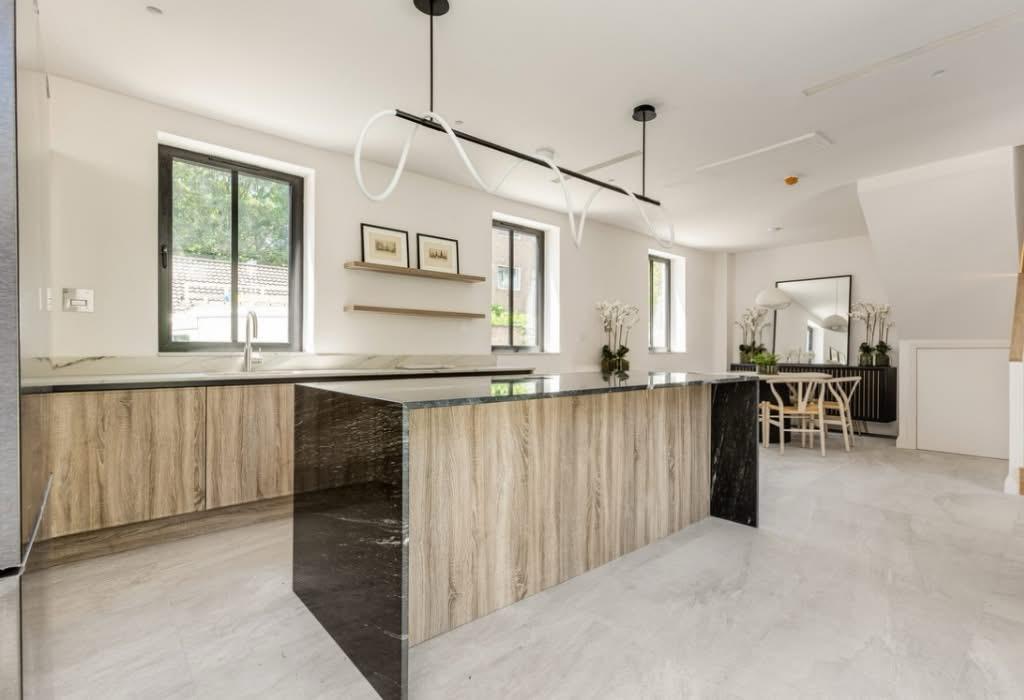 Finished kitchen and dining space with island.
