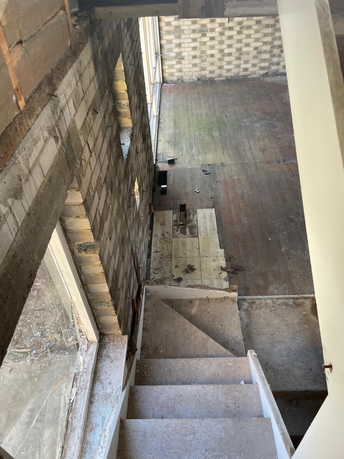 Stairwell viewed from above during the strip out.