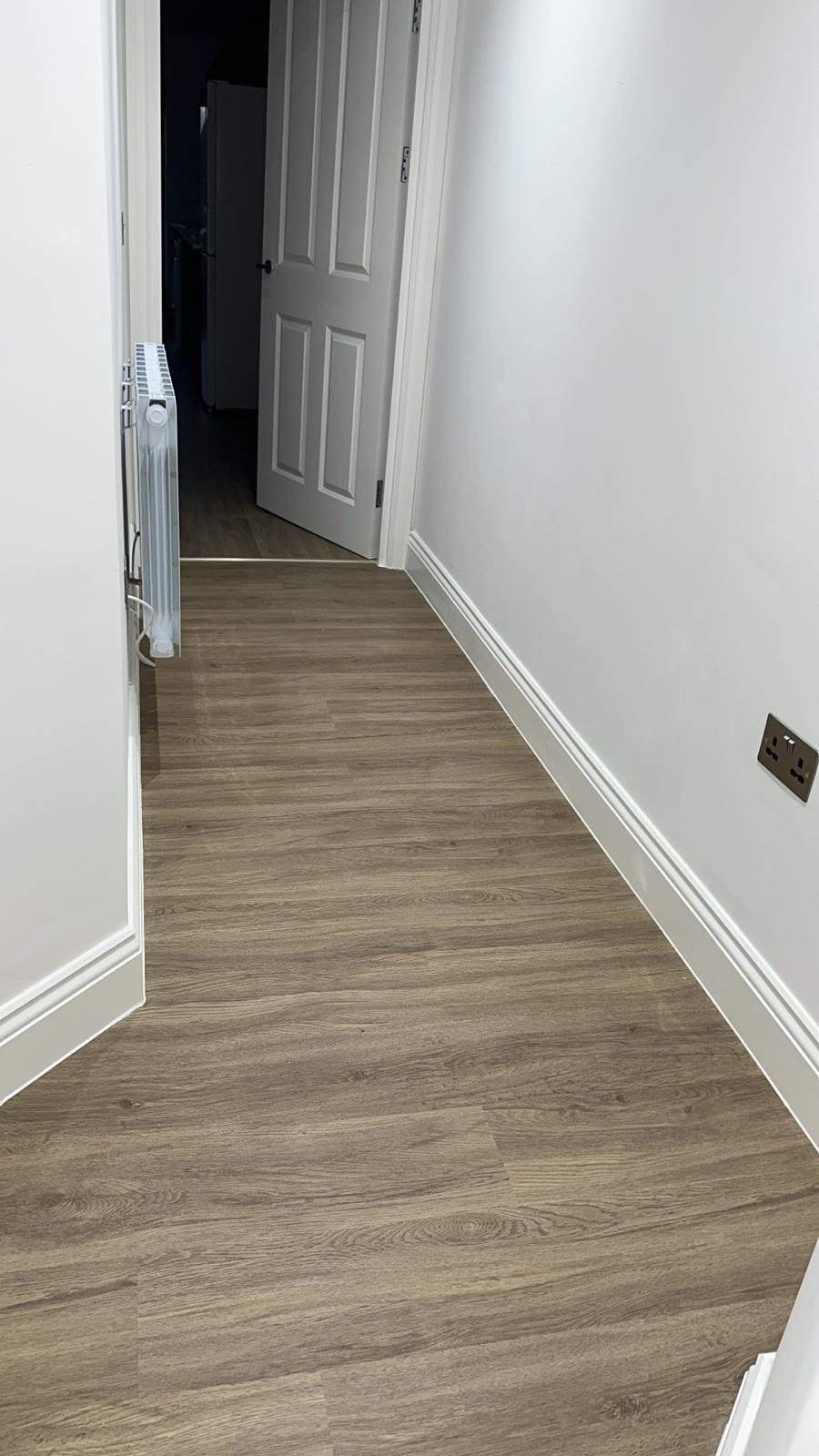 Finished hallway flooring ahead of handover.