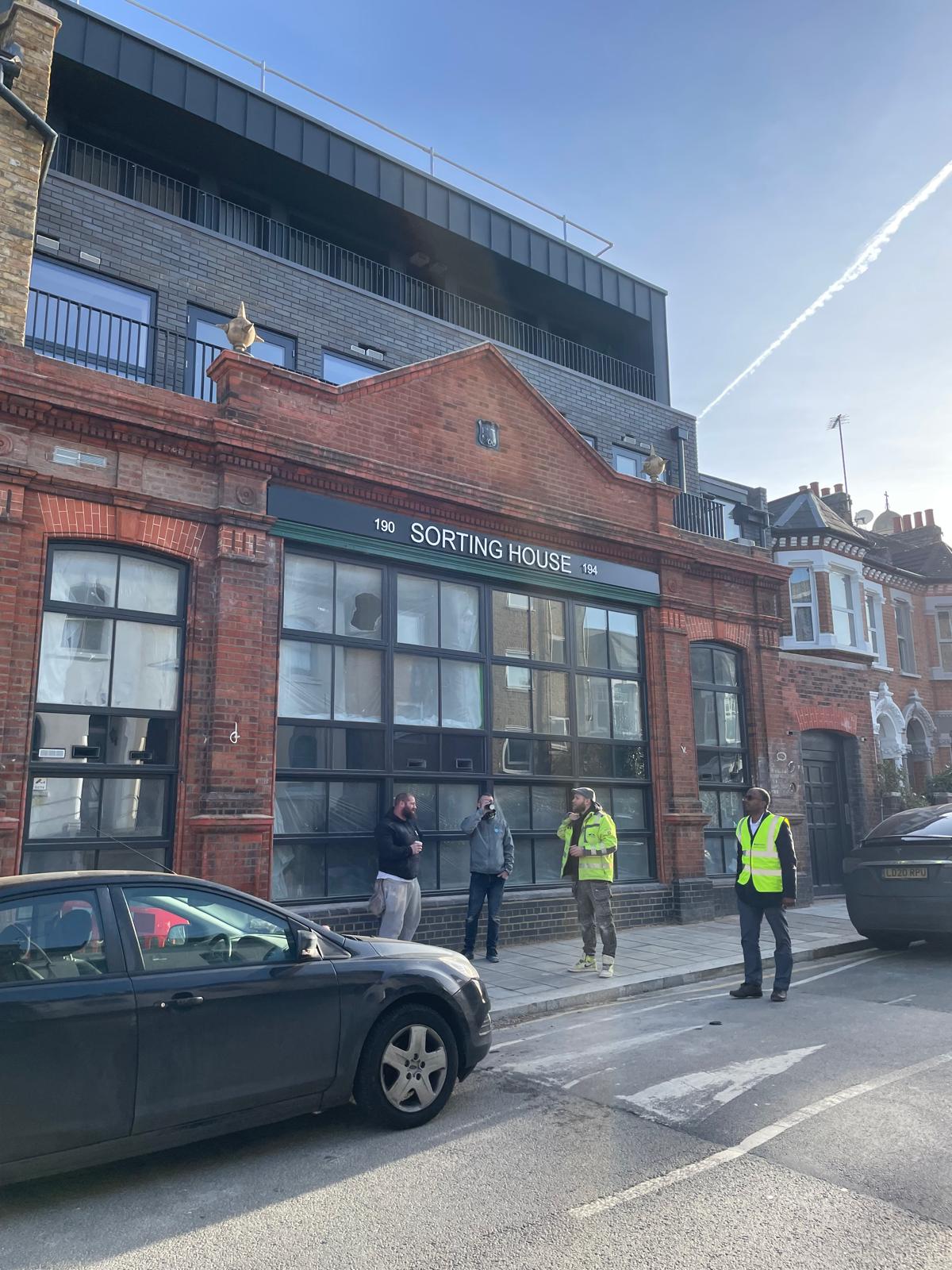 The former sorting house, with the completed rooftop extension above.