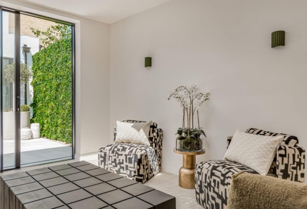 Finished sitting room opening onto the courtyard garden.