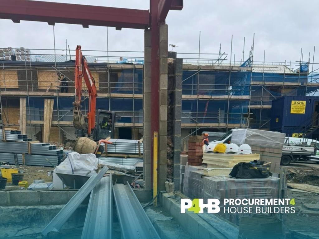 New steelwork erected above the existing blockwork.