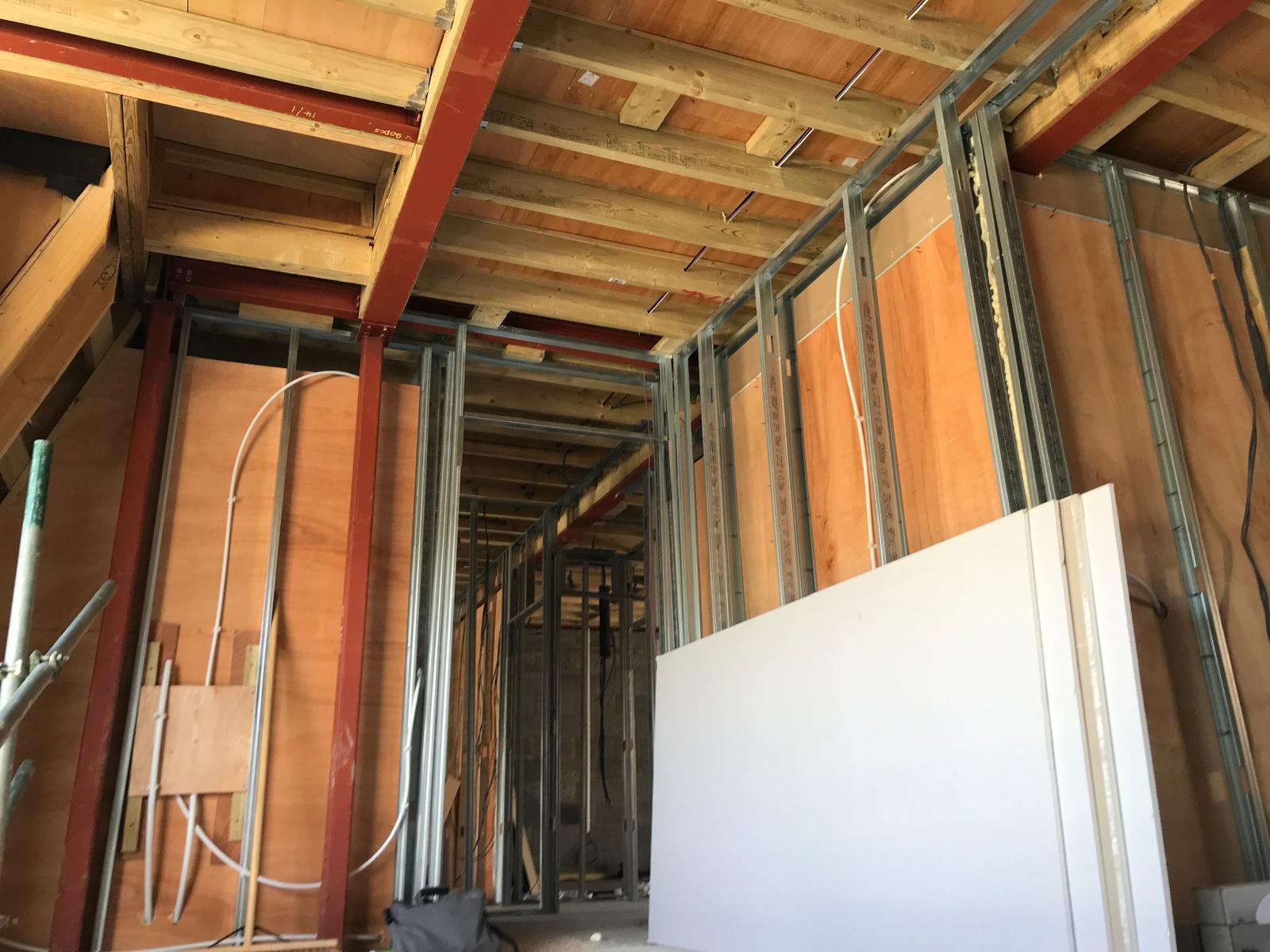 Steel beams and stud walls framing out the apartment layouts.
