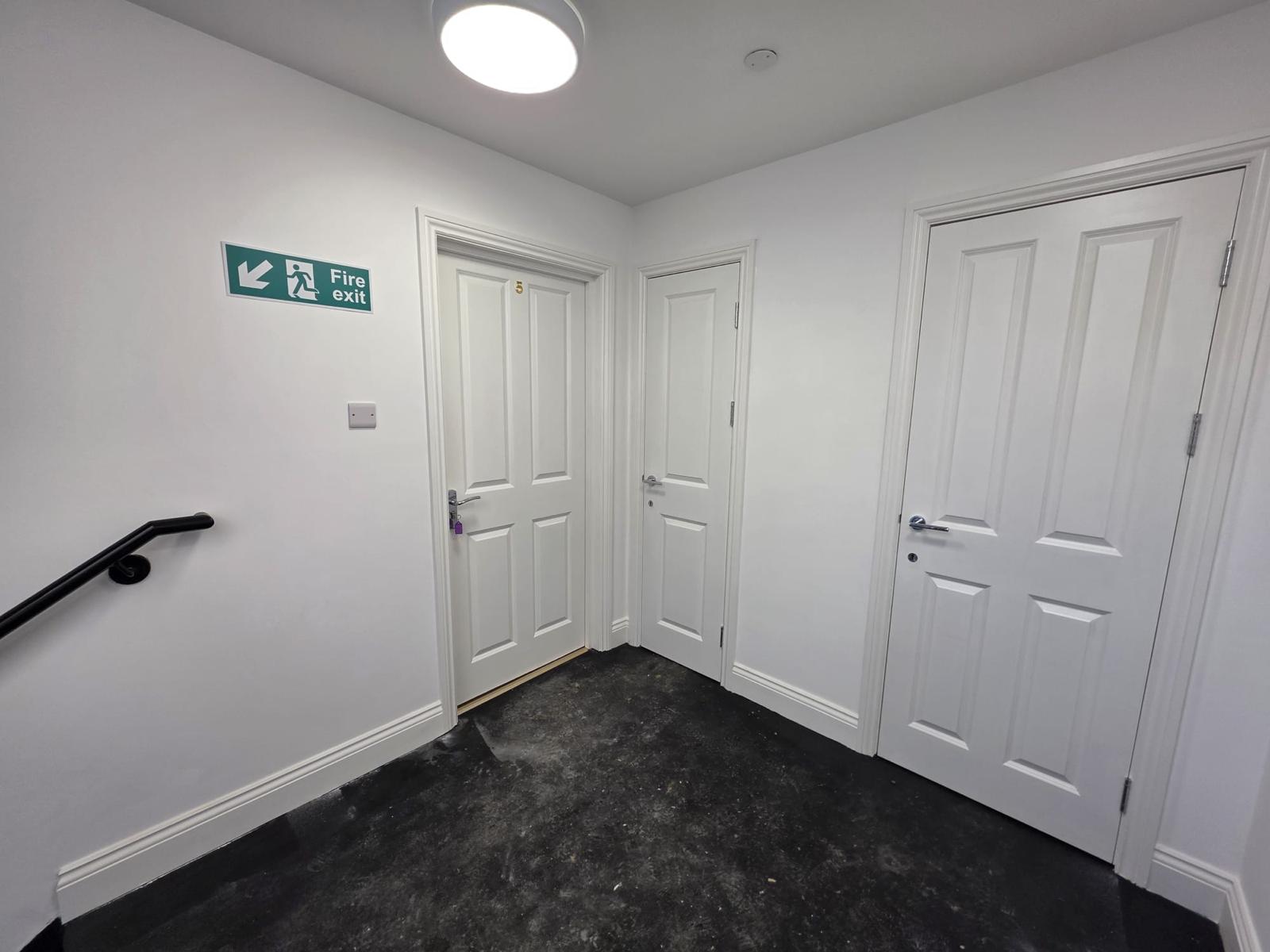 Internal corridor with fire doors and final fittings.