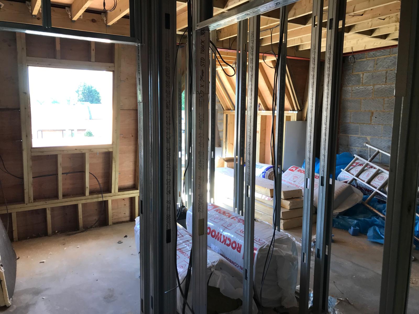 Metal stud partitioning and loft framing taking shape.