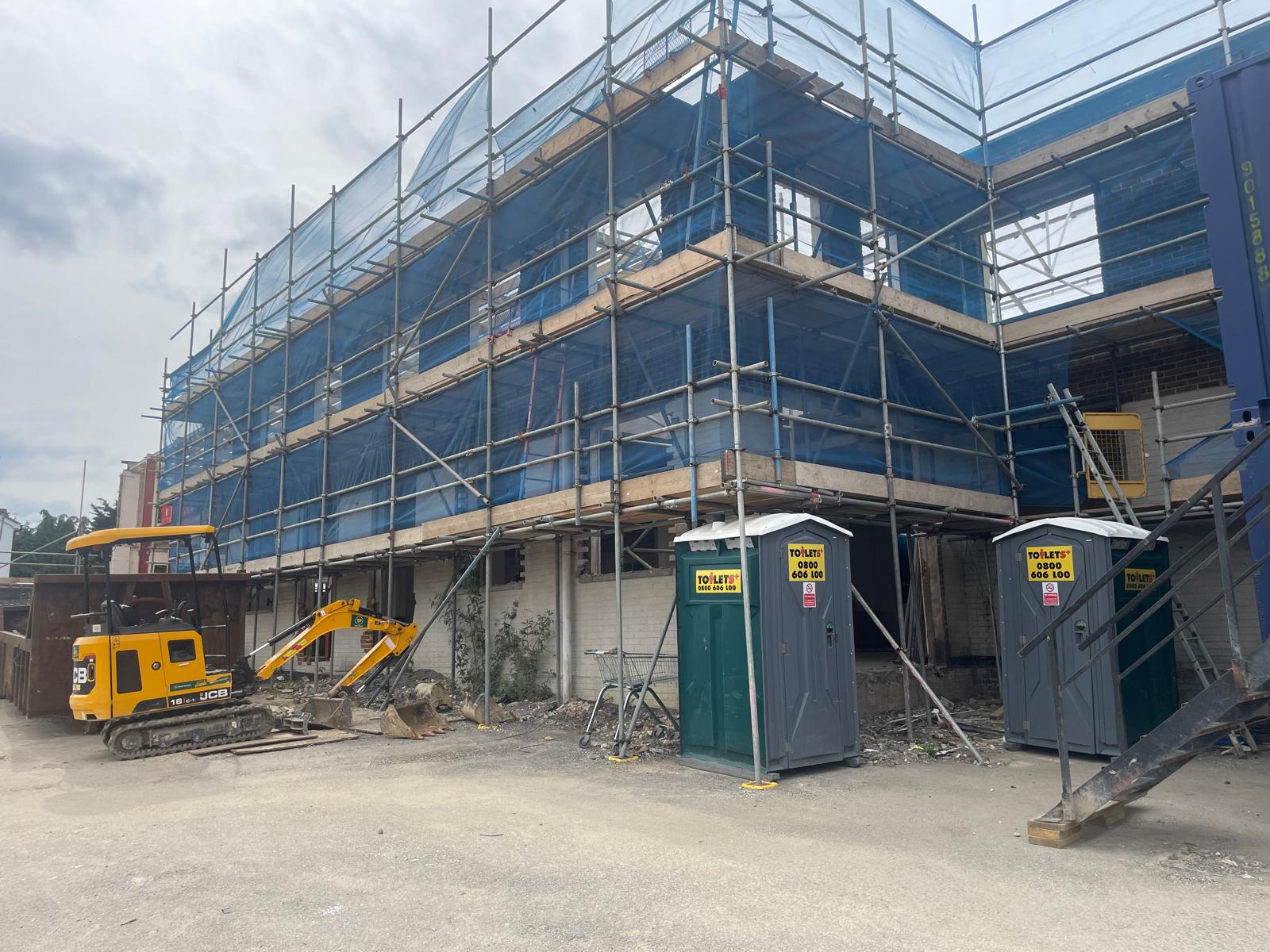 External scaffolding in place along the flank elevation.