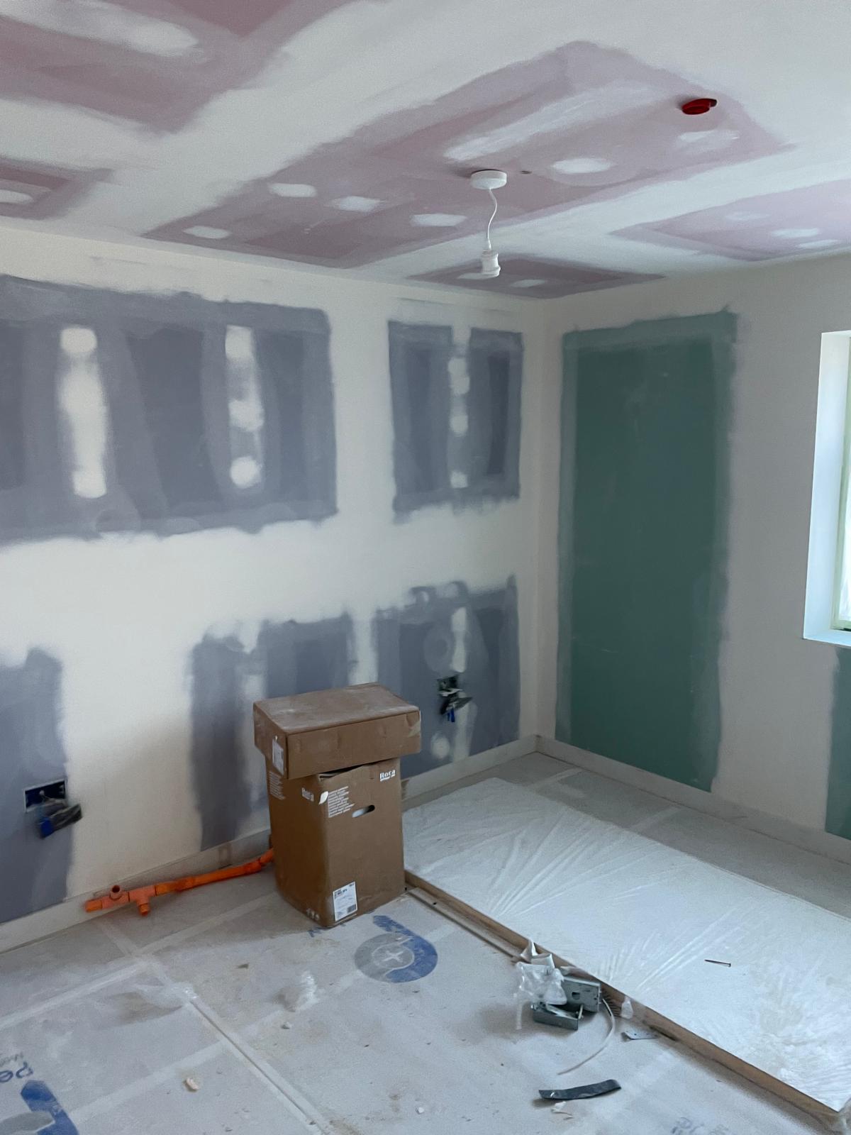 Walls and ceilings prepared for finishing.