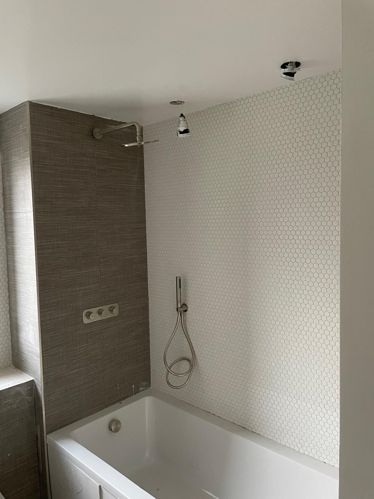 Bathroom tiling and fittings complete.