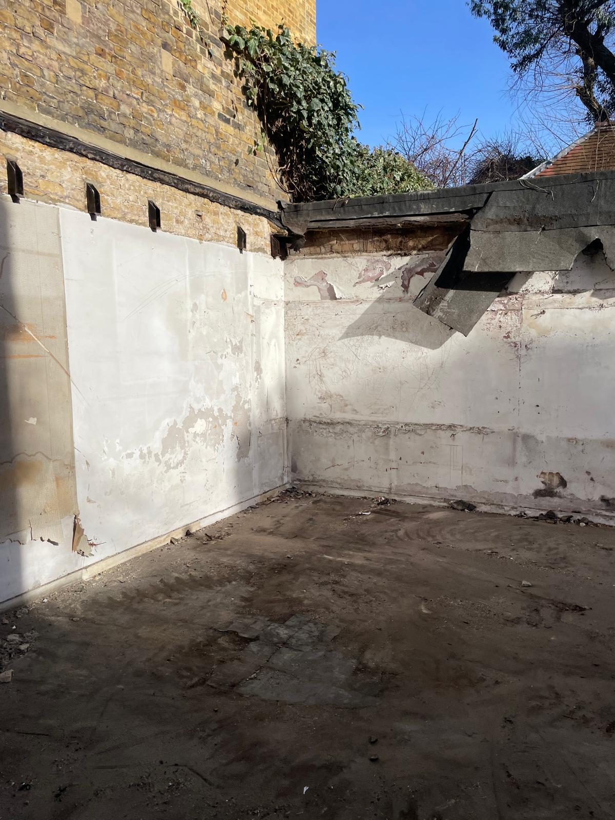 Rear elevation exposed during the strip out.