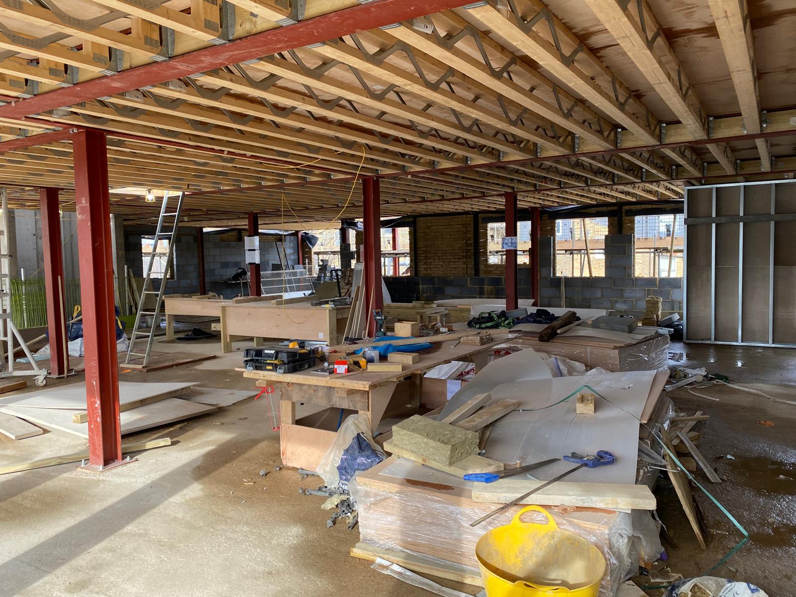 Metal web joists forming the new floor structure.