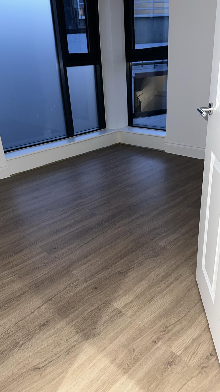 Finished living space with flooring laid.
