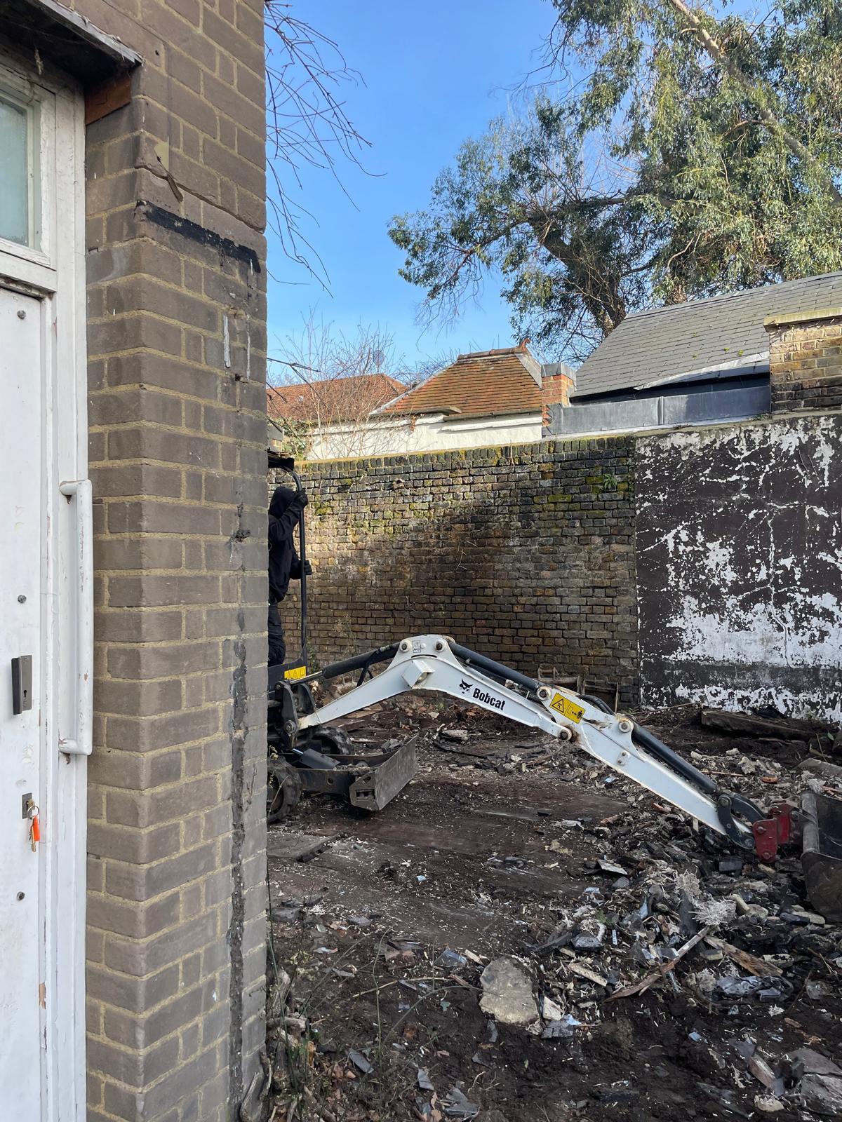 Demolition and site clearance in the courtyard.