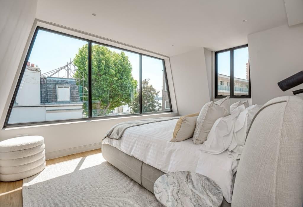 Principal bedroom with full height glazing, finished.