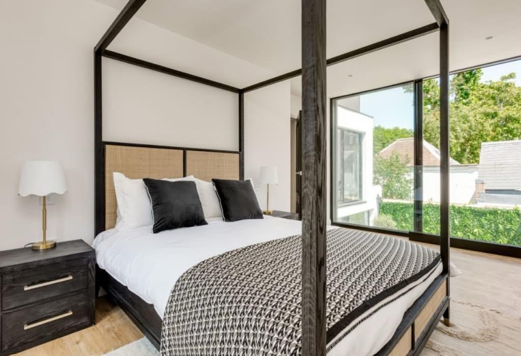 Finished bedroom suite with four poster bed.