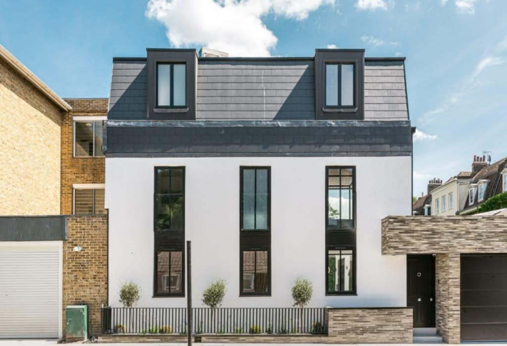 The finished property, completed facade and mansard roof.